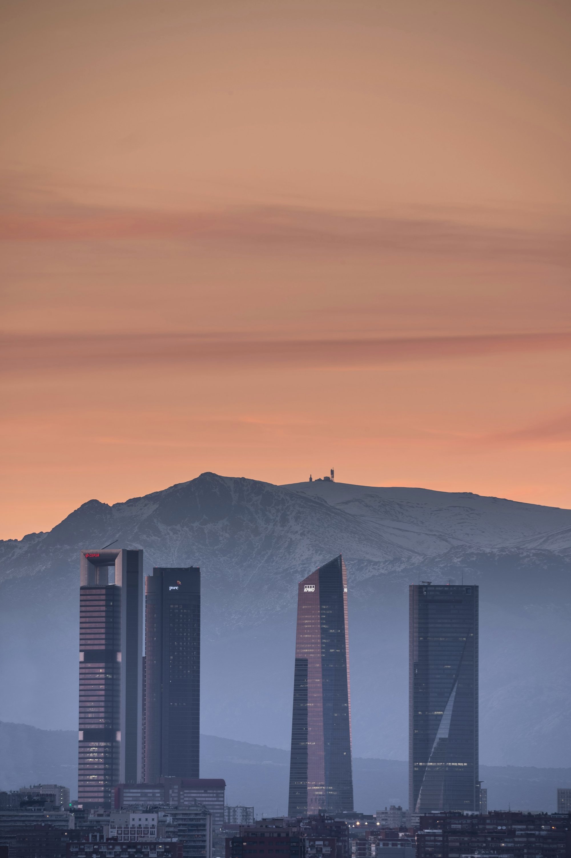 The Cuatro Torres business district in Madrid at dusk