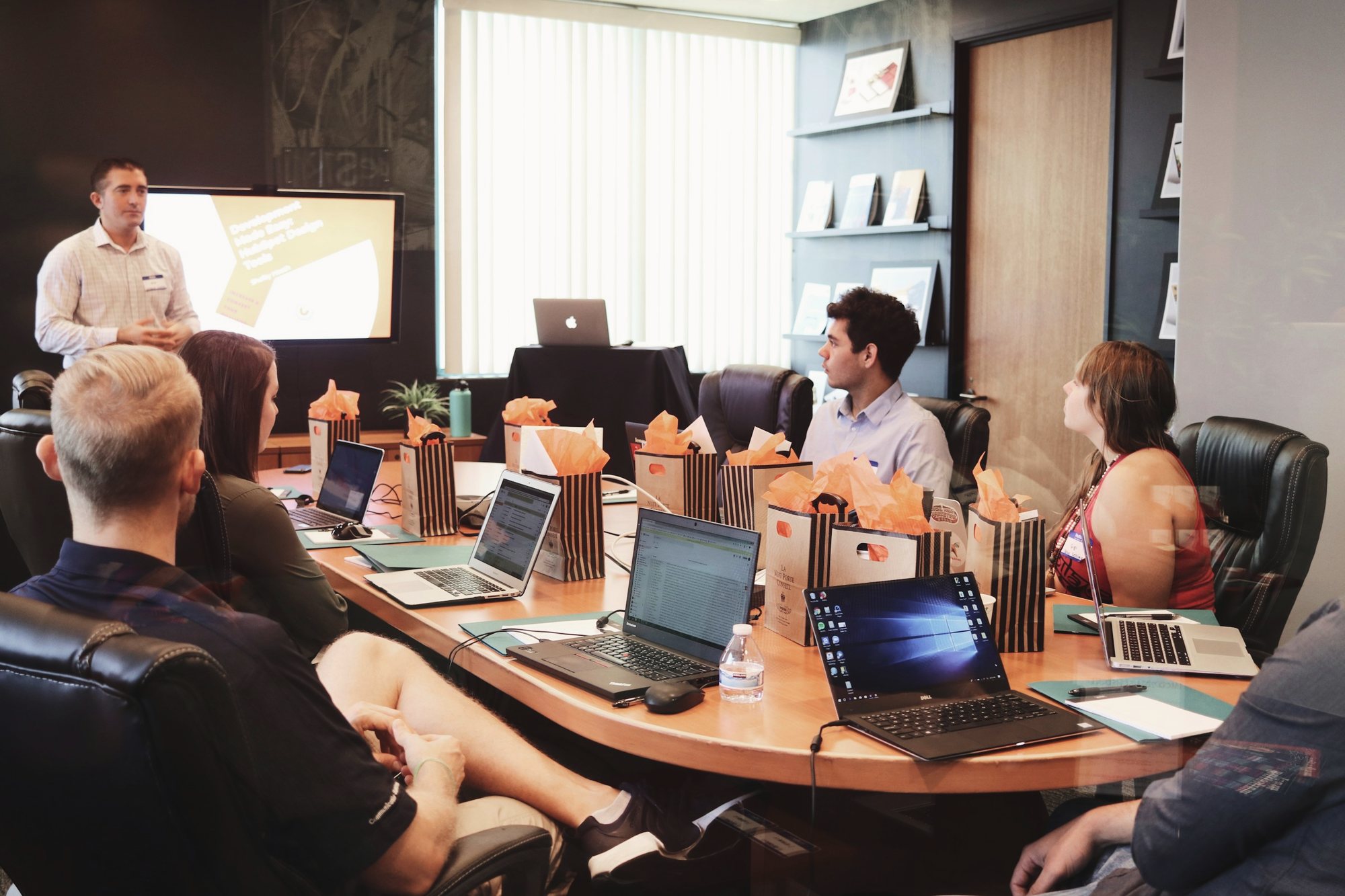 Founders meeting around a table in an open office